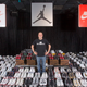Jordan Michael Geller poses with his collection of the Nike Air Jordan Retro line at the "ShoeZeum" in downtown Las Vegas, Nevada September 25, 2012. Record keepers at the Guinness Book of World Records recently certified that Geller's Shoezeum, a shrine to Nike that he says includes one of every model of Air Jordans ever made, holds the record for the world's largest collection of sneakers, with more than 2,500 pairs, all but eight of which are Nikes. Nike did not respond to calls for comment. Picture taken September 25, 2012. REUTERS/Steve Marcus (UNITED STATES - Tags: SOCIETY) - RTR38IBH